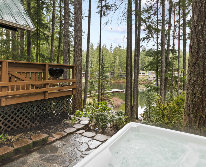 Year-round hot tub at Cloudloft Cabin with lake views