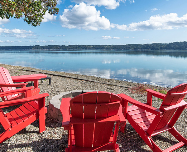 Private beach with waterfront firepit and Adirondack chairs on Hood Canal