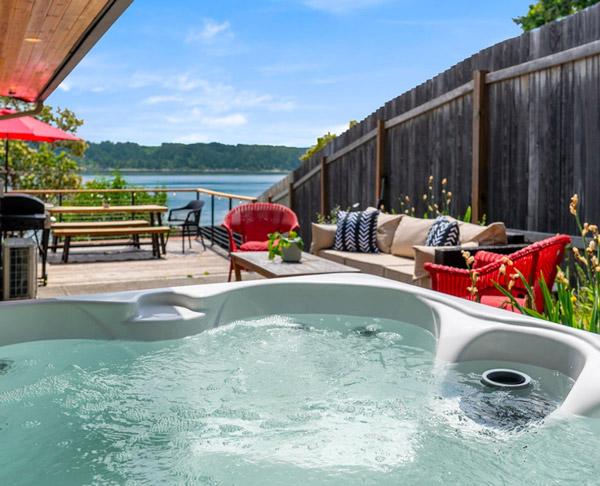 Year-round hot tub on oversized deck overlooking Hood Canal