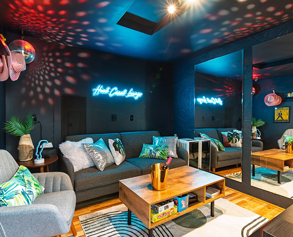 Speakeasy disco lounge with karaoke, neon lighting, and disco ball